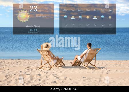 Young couple relaxing in deck chairs on beach and weather forecast widgets. Mobile application Stock Photo