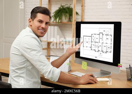 Architect making project of house on computer in office Stock Photo