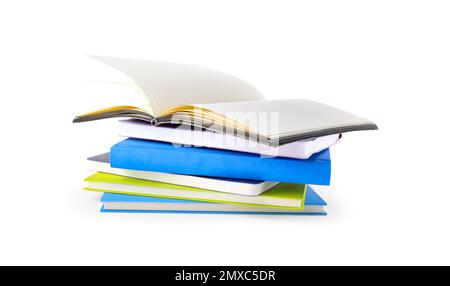 Stack of different notepads isolated on white Stock Photo