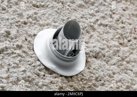 Gas condensing boiler vent or flue on outside wall of house Stock Photo