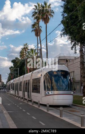 The Tel Aviv Light Rail commonly known as the DanKal moves along Jerusalem Boulevard, in the city of Jaffa Israel Stock Photo