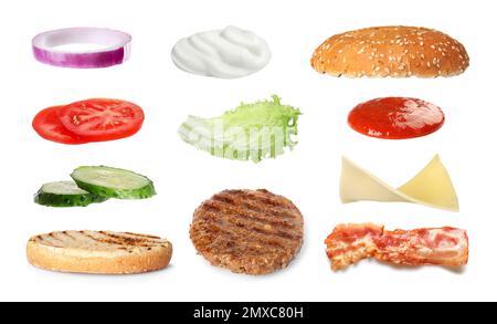 Set of ingredients for delicious burger on white background Stock Photo