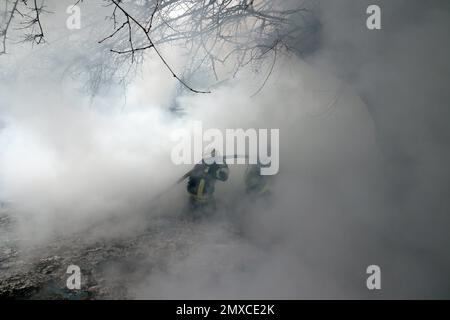 KRAMATORSK, UKRAINE - FEBRUARY 2, 2023 - Firefighters work to put out a fire after a rocket attack of Russian troops, Kramatorsk, Donetsk Region, east Stock Photo