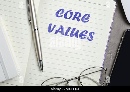 Core values concept. Flat lay composition with stationery on dark table Stock Photo