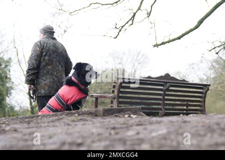 A person stands besides the bench where Nicola Bulley's phone was found, on the banks of the River Wyre, in St Michael's on Wyre, Lancashire, as police continue their search for missing the woman, who was last seen on the morning of Friday January 27, when she was spotted walking her dog on a footpath by the nearby River Wyre. Picture date: Friday February 3, 2023. Stock Photo