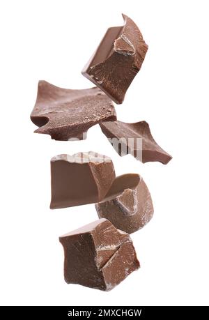 Delicious chocolate chunks falling on white background Stock Photo