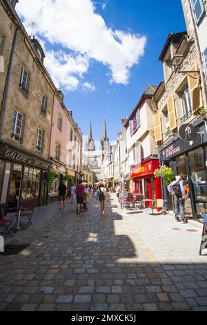 The tourist walking in the narrow street to the cathedral of Quimper in Brittany, France Stock Photo
