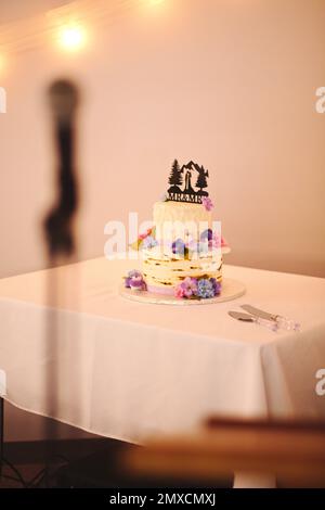 A vertical shot of a small wedding cake Stock Photo
