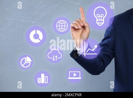 Businessman using virtual screen with business analytics information, closeup Stock Photo