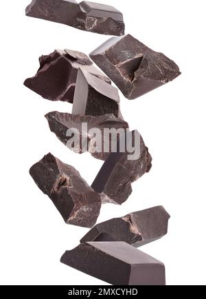 Delicious chocolate chunks falling on white background Stock Photo