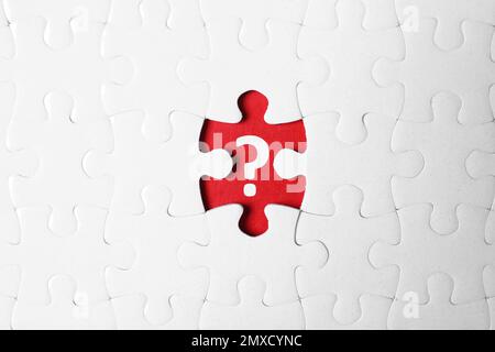 White puzzle with missing piece and question mark on red background, top view Stock Photo