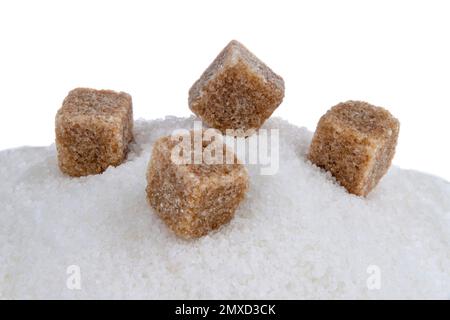 brown sugar cubes on white refined sugar Stock Photo