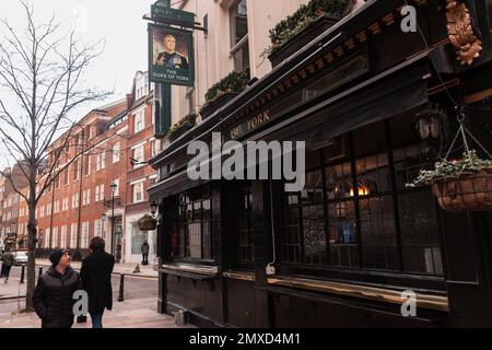 London, UK. 30th January, 2023. A man glances at the Duke of York public house in Fitzrovia. The pub was licensed in 1767 and rebuilt in 1897. Images of Prince Andrew, Duke of York, appear on pub signs outside. Credit: Mark Kerrison/Alamy Live News Stock Photo