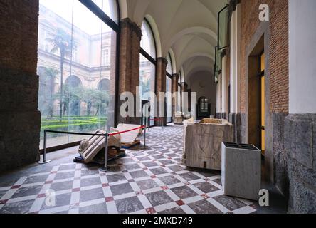 A view down a corridor by a courtyard, closed for an installation. At the Archeological Museum, Museo Archeologico Nazionale di Napoli, in Naples, Ita Stock Photo