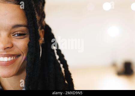 Image of happy african american female hip hop dancer posing to camera with copy space. Dance, rhythm, movement and training concept. Stock Photo