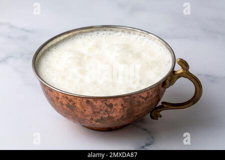 Ayran - Traditional Turkish yoghurt drink in a copper cup Stock Photo