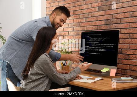 Professional programmers working with computer in office Stock Photo