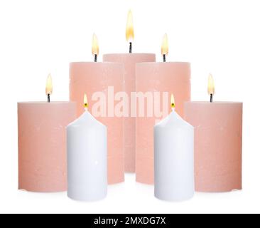 Pillar wax candle burning on white background Stock Photo - Alamy