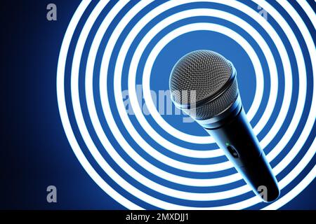 microphone, round shape model o neon background, realistic  3d illustration. music award, karaoke, radio and recording studio sound equipment Stock Photo