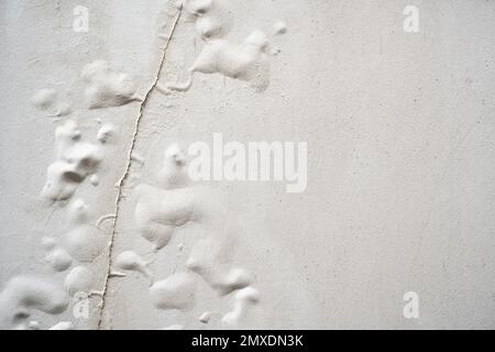 Problem of acrylic white color painting crack abstract surface texture on exterior concrete wall background by humidity.idea for repair old constructi Stock Photo
