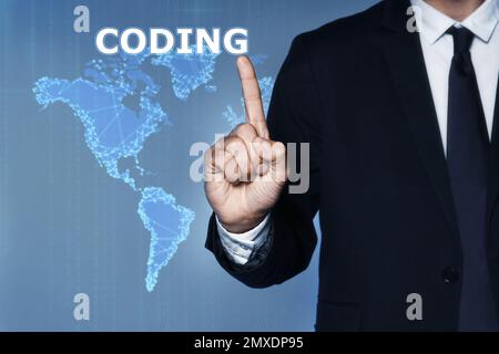 Businessman pointing at word CODING and illustration of digital map on background, closeup Stock Photo