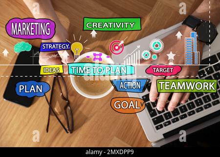 Strategic planning concept. Scheme and man using laptop on background, top view Stock Photo