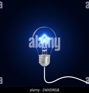 Light bulb with tungsten filament in shape on house on dark background. Energy efficiency, loan, property or business idea concepts Stock Photo