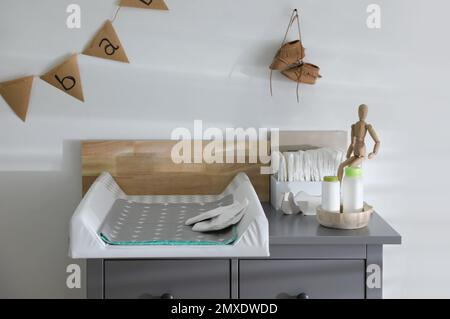 Modern changing table in baby room interior Stock Photo