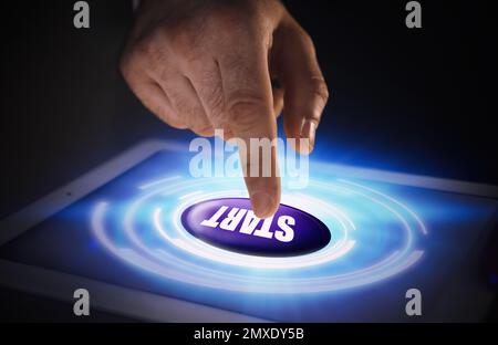Man pointing at start icon on tablet, closeup Stock Photo