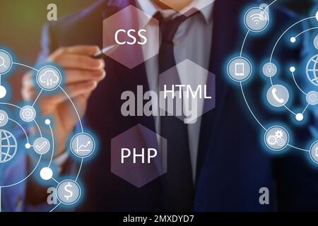 Web development. Man using button CSS on virtual screen, closeup Stock Photo