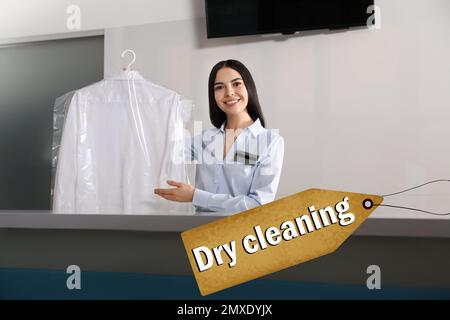 Female worker with shirt at modern dry-cleaner's Stock Photo