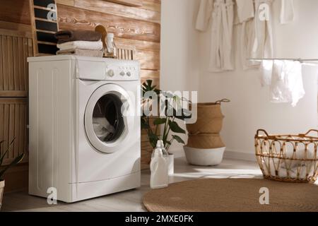 Stylish room interior with washing machine. Design idea Stock Photo