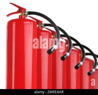 Set with fire extinguishers on white background Stock Photo
