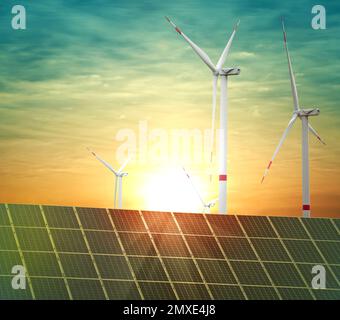Solar panels and wind turbines installed outdoors. Alternative energy ...
