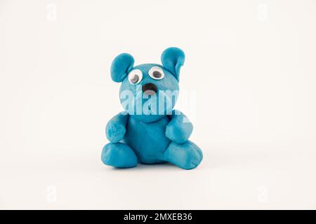 hand crafted cute toy teddy bear with plastercine play doh isolated on a white background Stock Photo