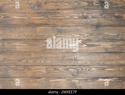 background of textured teak-coloured rough-finished pine planks Stock Photo