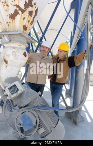 two builders on construction site Stock Photo