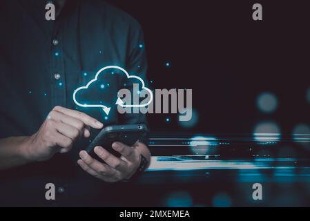 Businessman holding smartphone technology digital with cloud computing icon.Business Cloud computing concept . Stock Photo