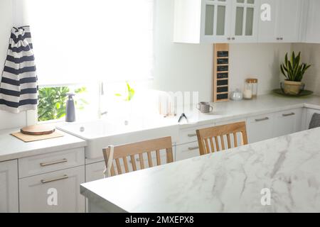 Modern kitchen interior with stylish marble table Stock Photo
