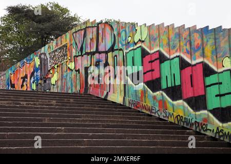 Graffiti covered fence on steps in Trocadero Gardens, Paris, France Stock Photo