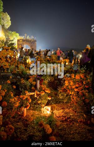 A vertical shot of a cemetery during the Day of the Dead in Michoacan, Mexico. Stock Photo
