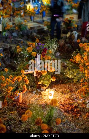 A vertical shot of a cemetery during the Day of the Dead in Michoacan, Mexico. Stock Photo