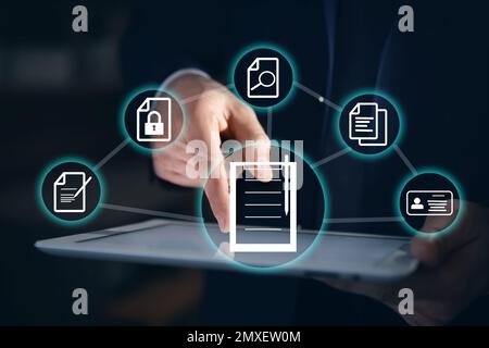 Man using tablet and document icons, closeup Stock Photo