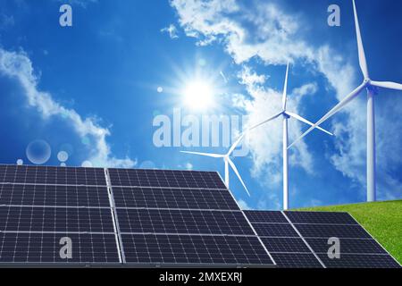 Solar panels and wind turbines installed outdoors. Alternative energy source Stock Photo