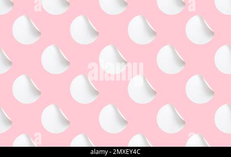 Blank white folded stickers tile pattern on a pink background. Stock Photo