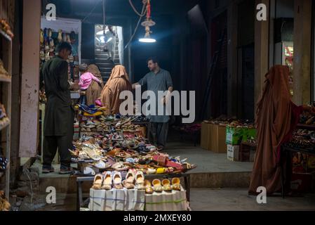 Women wearing burqa in a market, Swatt Valley, Pakistan Stock Photo