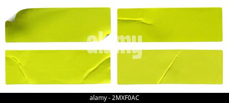 A set of fluorescent neon yellow rectangular paper sticker label isolated on white background. Stock Photo