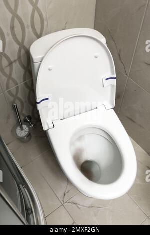 Toilet bowl before and after cleaning in bathroom Stock Photo