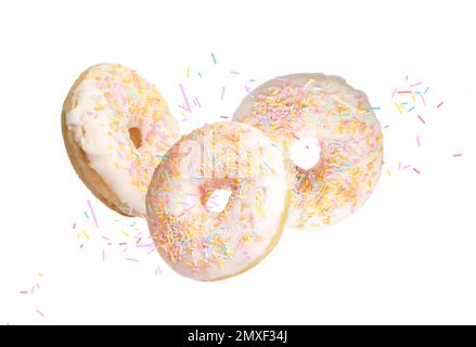 Set of falling delicious donuts on white background Stock Photo - Alamy