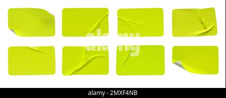 A set of fluorescent neon yellow rectangular paper sticker label isolated on white background. Stock Photo
